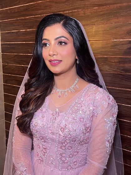 A side view showcasing the soft flow of the waves under the veil, creating a truly ethereal bridal look.