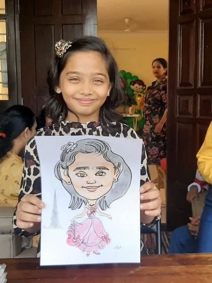 A beautiful smile from a happy guest at a kid's birthday party. Her princess caricature is a wonderful keepsake.