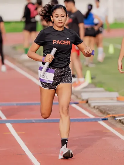 Speed and focus in the heat of competition. A track relay isn't just about running fast, it's about precision and teamwork. My coaching sharpens your explosive power for moments just like this.