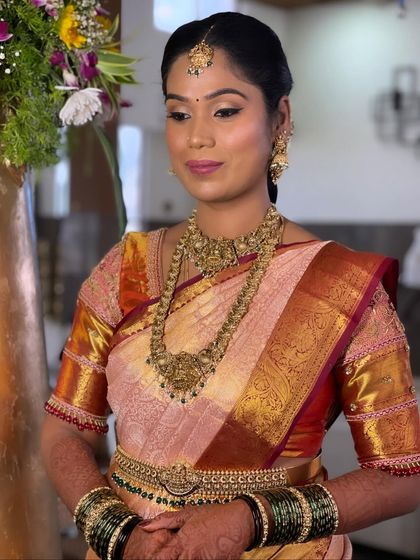 A candid moment showing the bride's soft, glowing makeup. I use techniques that ensure the makeup is sweat-proof and photo-ready, so the bride looks fresh for hours.