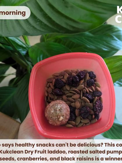 For a mid-morning snack, I love this mix of my homemade dry fruit laddoo, roasted pumpkin seeds, cranberries, and raisins. It's the perfect combination of sweet and crunchy to beat any cravings.