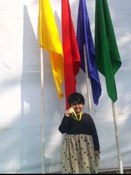 Another photo of Nataniya celebrating her first prize win at the instant painting competition. We provide art competition coaching to help students perform their best under pressure.
