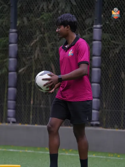 A coach providing hands-on guidance during a personal training session. This focused attention is key to rapid development.