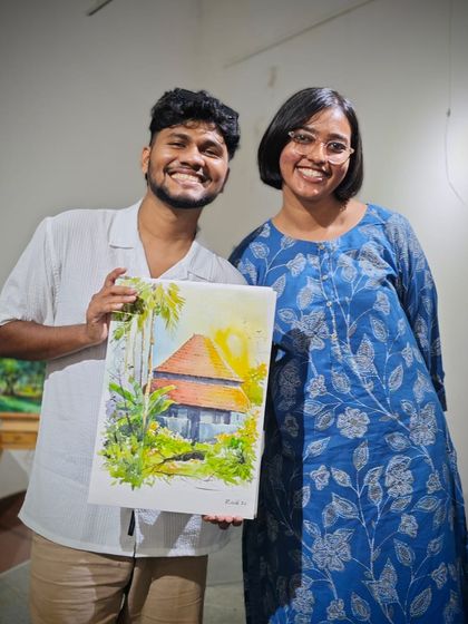 A happy moment after the demo, posing with an attendee and my finished painting. Connecting with other artists and sharing the joy of creation is what it's all about.