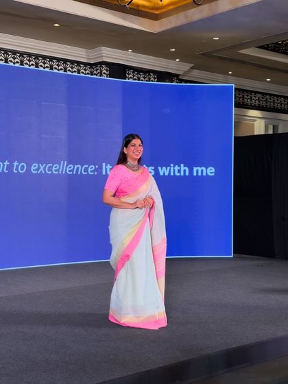 A full-length view of me on the Dockendale stage, embodying the event's theme: "Our commitment to excellence: It starts with me."