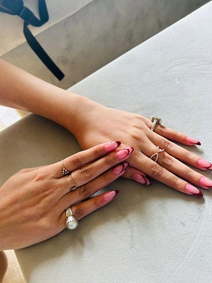 An elegant, elongated French manicure with a deep red tip and a subtle secondary line for added dimension.