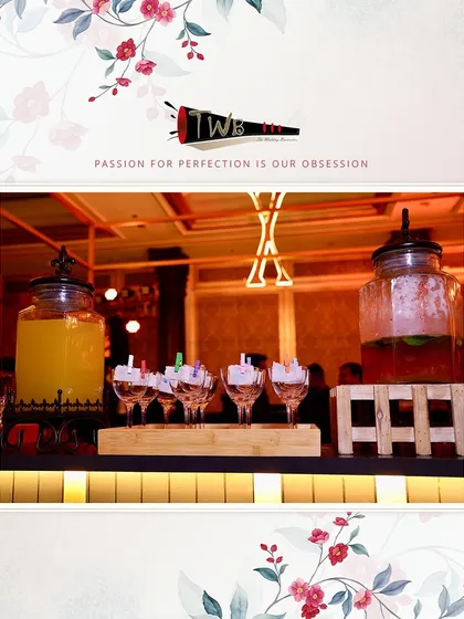 A welcome drink station with infused water dispensers and pre-poured mocktails for guests upon arrival.