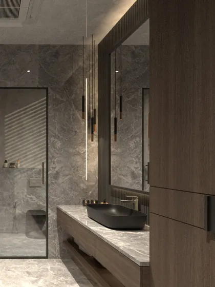 The bathroom in this moody villa concept features deep grey stone walls and a rich wood veneer vanity. A sleek black basin and minimalist pendant lights complete the modern, tactile, and comforting design.