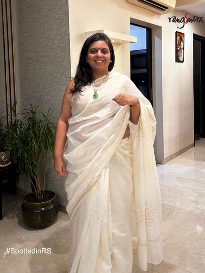 A happy customer shining in our Saba Off-White Saree. The delicate crewel embroidery and soft Chanderi silk make it a piece of elegance that speaks for itself.