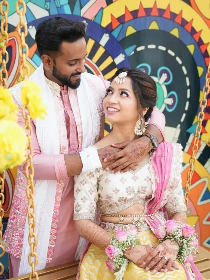 An intimate portrait of the couple on a swing. The bride's makeup is soft and romantic, enhancing her natural beauty.