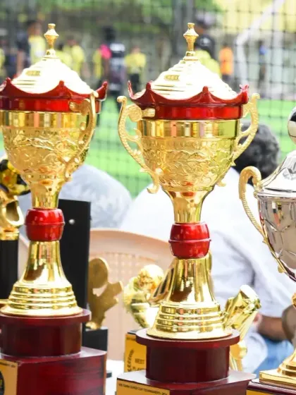 The complete set of winner and runner-up trophies for the FANM SUPER CUP, waiting to be claimed by the top teams.