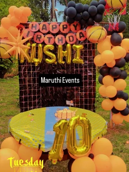 A slam dunk of a party with this basketball theme. The orange and black decor includes basketball-shaped balloons, a net prop, and a large number "10" for the birthday boy.