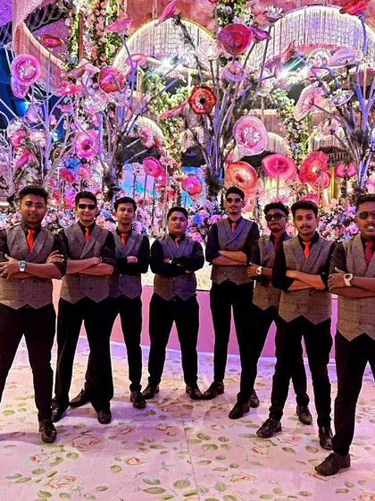 Meet the team that makes it all happen. This is a part of our professional, uniformed crew, ready to serve at a large wedding. We pride ourselves on teamwork and ensuring your event runs smoothly from the first drink to the last.