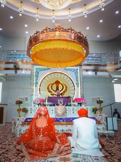 Capturing the serene and sacred atmosphere of an Anand Karaj ceremony in a Gurudwara. I respect the traditions of every wedding I shoot, focusing on wide shots like this to show the grandeur of the space and the solemnity of the moment.