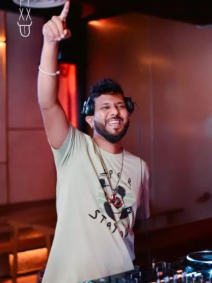 Pointing to the sky. It's all about working hard and playing hard.