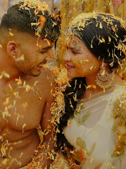 This is the beautiful chaos of a Haldi ceremony. It’s more than just a ritual; it’s an explosion of joy, laughter, and color. This intimate shot of the couple, lost in the moment and covered in petals, shows the fun and authentic energy I love to capture.