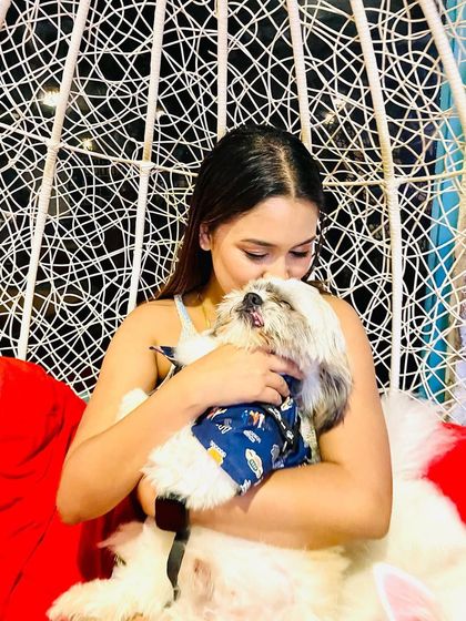 The purest form of love is a birthday cuddle. This pet parent is sharing a sweet moment with her doggo on his special day at our cafe.