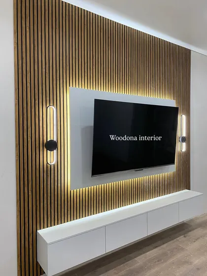 A clean and modern TV unit is my specialty. Here, I used a combination of fluted wood panels for texture and a floating white console for a minimalist look. The hidden backlighting gives it a premium feel and makes the wall a centerpiece.