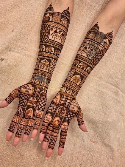 A closer look at the hands from the Muscat bride's mehendi, showing the intricate grid work filled with personal symbols and traditional motifs.