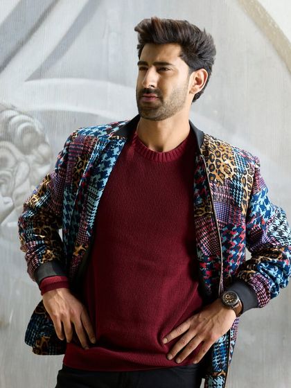 The multi-patterned jacket is crafted for the discerning gentleman. Its sophisticated aesthetic ensures you will stand apart with an unparalleled sense of style.
