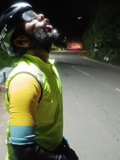 The face of pure exhaustion and determination. A rider on the Western Ghats Odyssey (WER) 1500km race pushes through the night, battling fatigue to reach the finish line.