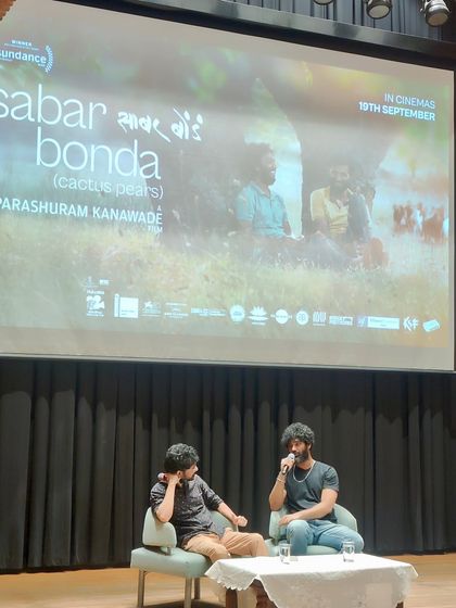 An insightful Q&A session with the filmmakers of 'Sabar Bonda' on stage. Post-screening discussions are a key part of our events, allowing the audience to engage directly with creators.