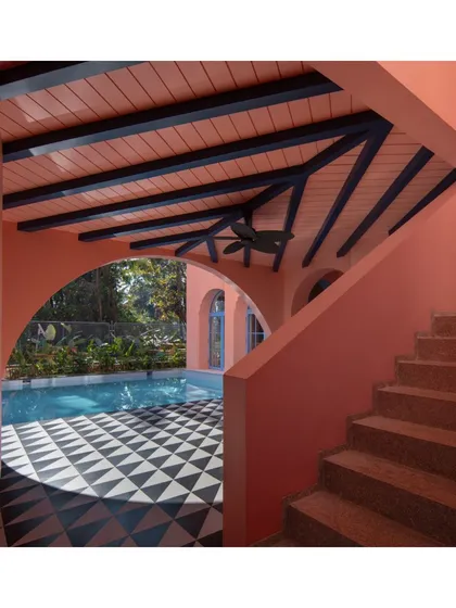 The veranda is a classic architectural element, and at Baia Villas, I reinterpreted it with a modern sensibility. The space is bathed in a warm pink glow, with light and shadow creating a poetic, ever-changing canvas that connects the indoors with the outdoors.