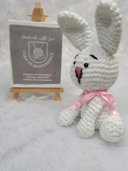 This little 6-inch bunny soft toy is perfect for small hands. It's made in classic white with a simple pink ribbon.