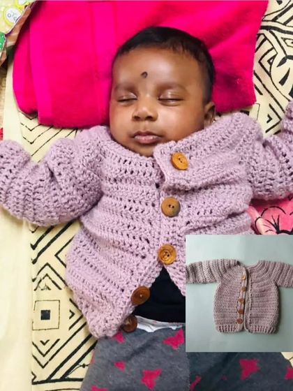 A cozy and classic baby sweater with wooden buttons. This piece is perfect for keeping your little one warm while still looking adorable. The inset photo shows the product before it was shipped to the client.