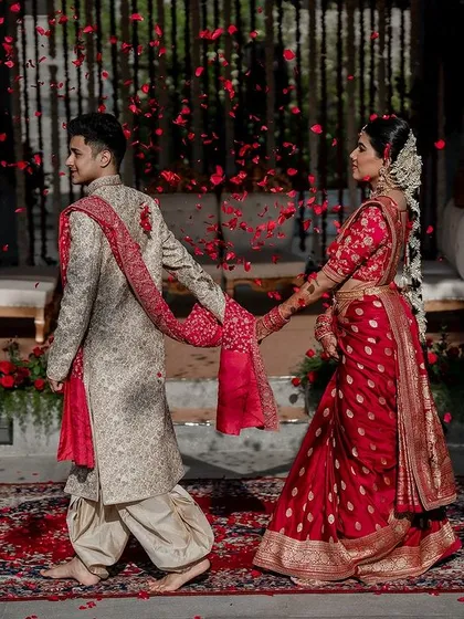 We live for moments like these. A grand exit under a shower of petals for Laksha and Partha, perfectly capturing the magic of their Sabyasachi and Tarun Tahiliani ensembles at the breathtaking Amitarasa venue.