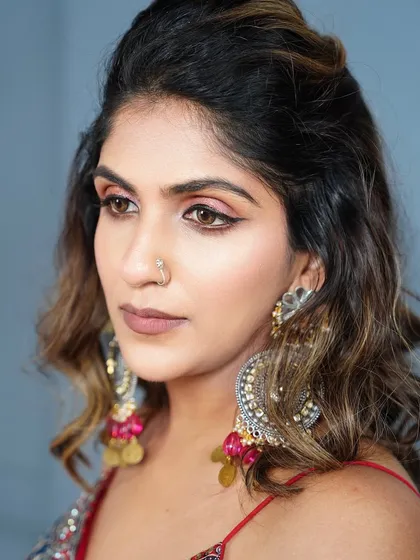 A detailed shot of the Navratri eye makeup. The combination of rose gold shimmer and a sharp wing liner creates a look that is both festive and glamorous.