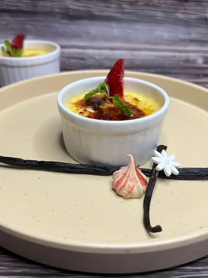 A classic French Crème Brûlée with a perfectly caramelized sugar top. You will learn to make this elegant dessert, including how to use a torch for that signature crackle.
