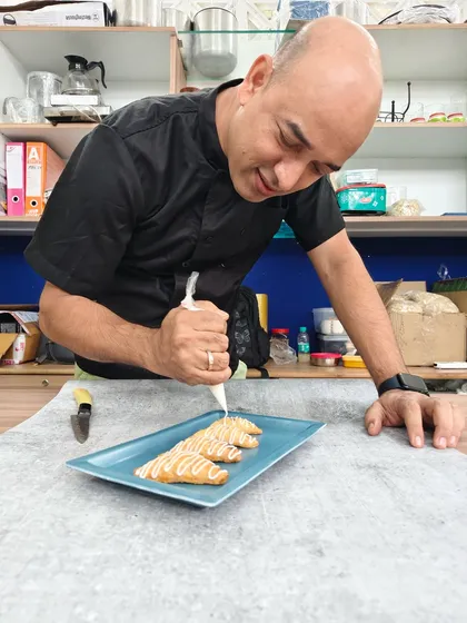 Warning: may cause uncontrollable dessert cravings! Here I am, adding the final drizzle to our Cherry Cheesecake Turnovers.