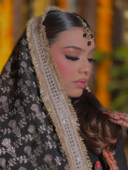 A close-up of a soft yet defined eye makeup look. The winged liner is sharp and precise, while the eyeshadow is blended seamlessly.