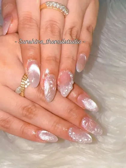 Another angle of the white cat eye and pearl snowflake nails.
