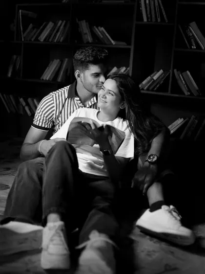 Our indoor library corner provides a cozy and intimate setting for couple photoshoots. The warm lighting and book-filled shelves create a classic, romantic ambiance, perfect for quiet, personal moments captured in a timeless black and white style.