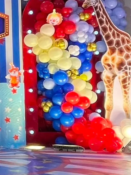 A close-up of the vibrant balloon decor and character cutouts used in our circus-themed parties, adding color and excitement to the main photo area.
