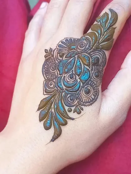 A slightly different angle of the shaded rose design, showing the detail in the petals and surrounding leaf work.