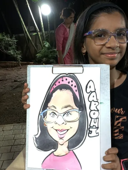 A young girl happy with her colorful caricature from a flea market event. I love seeing the excitement in kids' eyes.