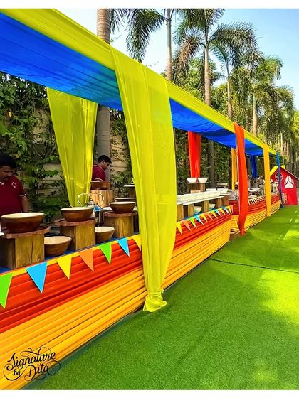 The buffet line under a colourful draped canopy, keeping the food service area bright and festive, in line with the Paw Patrol theme.