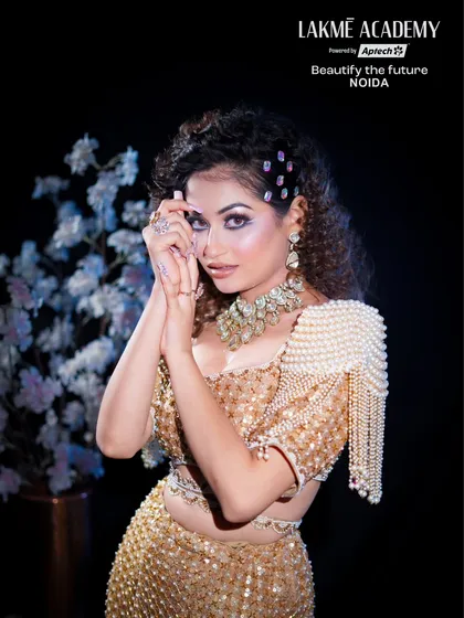 A full-length shot of the model, showcasing how the glam makeup, hair, and nails come together for a complete look. We teach our students to think about the entire aesthetic, not just one element.