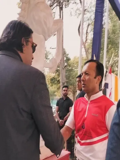 Shaking hands with a guest at a polo event. We are equipped to handle large-scale outdoor events with the same level of finesse as an indoor gala.