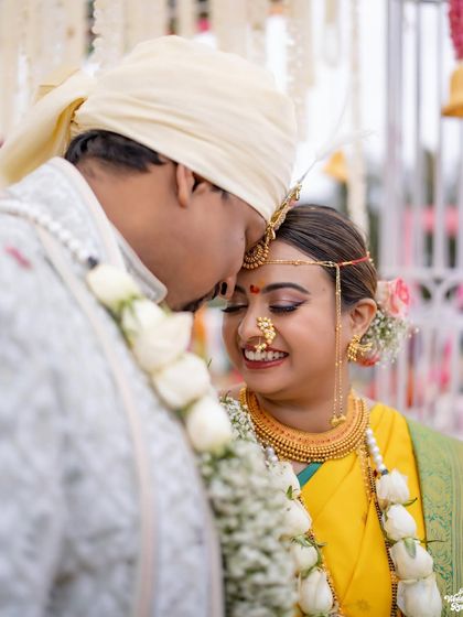 An intimate close-up of the couple during their wedding ceremony in the hills, full of smiles and love.