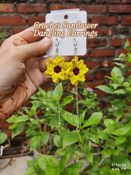 Bringing some sunshine to your look with these handmade crochet sunflower dangling earrings. I love how the delicate silver chain and tiny green leaf add a little extra movement and charm. These are lightweight and perfect for a boho, free-spirited style.