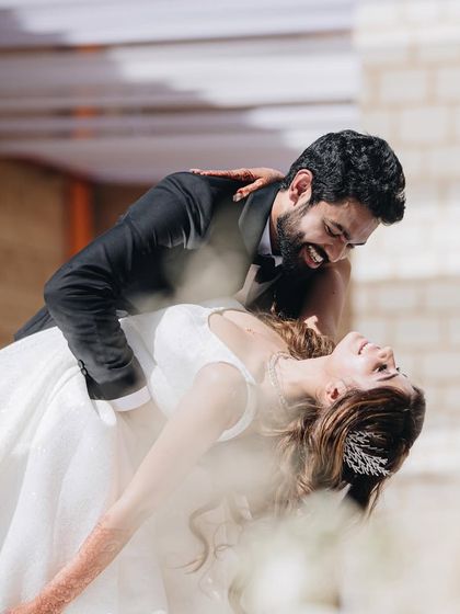 A candid moment of pure joy and romance during a white wedding dance. We choreograph for all types of ceremonies, ensuring the dance always matches the theme.
