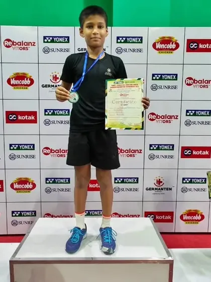 Standing proud on the podium, Mayuresh after a hard-fought tournament at the Kotak Pullela Gopichand Badminton Academy.