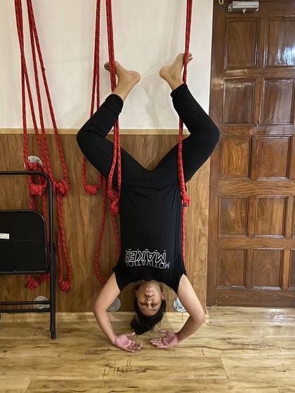 Wall ropes are fantastic for inversions like this supported headstand (Shirshasana). They help decompress the spine and build upper body strength without putting pressure on the neck, making it a safe way to get upside down.
