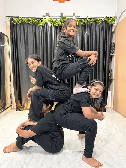 We make appearances on Friday. A fun, pyramid pose from our students, capturing the teamwork and friendships formed in our dance classes.