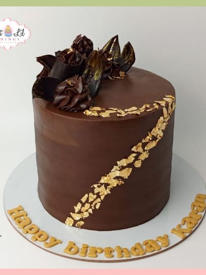 A rich and decadent chocolate cake for Karan's birthday, decorated with gold leaf and chocolate shards.