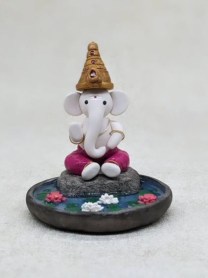 A close-up look at the hand-sculpted details of my Ganesha in a lotus pond. Each element, from the golden crown to the serene expression, is crafted with patience and love.
